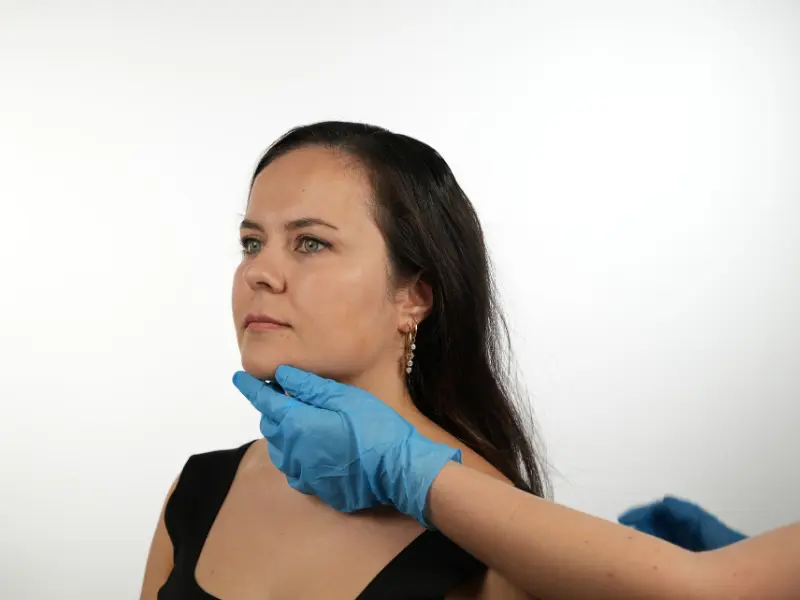 Woman displaying smooth, tightened neck contours and natural skin texture after undergoing a Twilight facelift and neck lift procedure in Turkey.