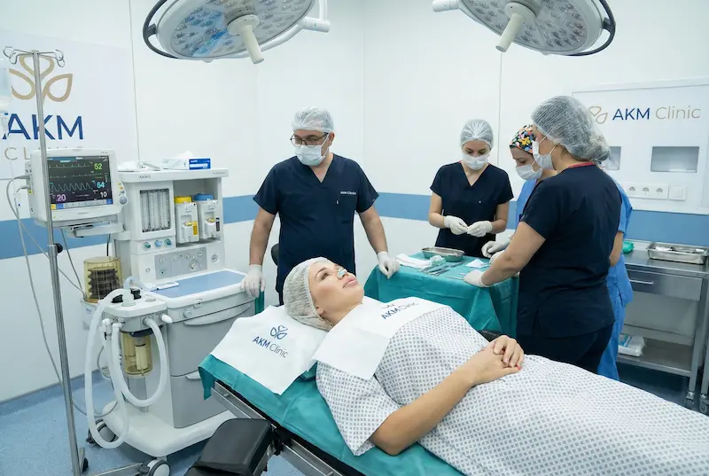 Operating room scene showing patient prepared for surgery with anesthesia monitoring equipment and surgical team, illustrating anesthesia safety and surgery day expectations.